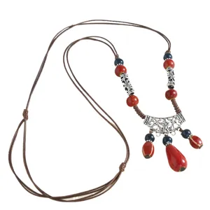 Bohemian long ceramic beaded necklace with retro water drop pendant and brown cord sweater chain.