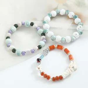 Nuovo set di bracciali in ceramica in stile cinese con perline e ciondoli a conchiglia.