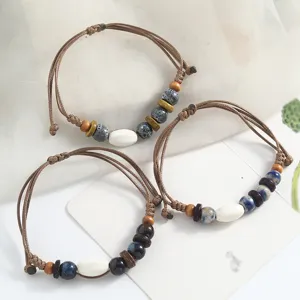 Vintage ethnic handmade braided ceramic bead bracelet set for daily casual wear style.
