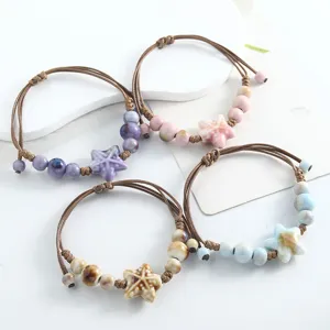 Handmade ceramic starfish beaded woven bracelets set of four pastel colors for women.