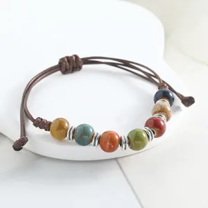 Handmade ceramic beaded braided bracelet, niche Mori style ethnic jewelry for daily wear.