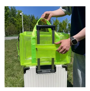 Outdoor travel PVC mesh bag detail, featuring luggage handle sleeve and portable design.