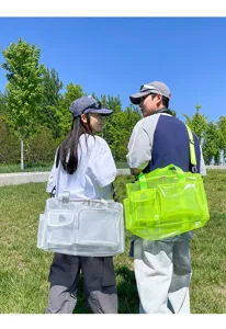 Clear PVC mesh beach travel bag with multiple pockets and adjustable strap for outdoor use.