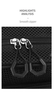 Detail view of black mesh backpack double smooth zippers and durable woven pull tabs.