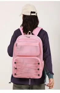 Detail view of the pink mesh hollow-out backpack, large capacity casual sports design.