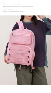 Pink mesh backpack with large capacity, ideal for casual holiday, beach, and sports use.