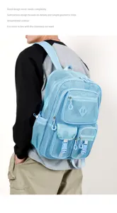 Light blue mesh backpack with multiple pockets, casual hollow design for beach vacation.