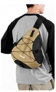 Nylon cross-body chest bag detail view, showing durable buckle, bungee cord and khaki color.