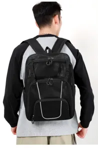 Durable black mesh sports backpack with reflective strips, ideal for outdoor basketball and gear.