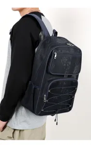 Detailed view of the breathable mesh backpack showing durable zipper pockets and elastic cords.