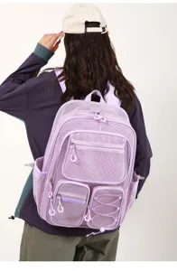 Sac a dos en maille violette clair avec multiples poches et grande capacite pour ecole.