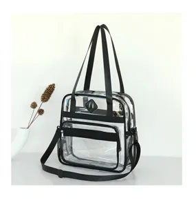 Clear PVC travel bag detail showing transparent material, black straps, and zipper pocket.