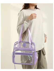 Clear PVC tote bag detail view, multi-pocket design, transparent stadium handbag style.