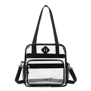 Clear PVC tote bag with black straps, multi-pocket stadium approved shoulder handbag for travel.