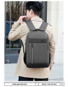 Detail shot of grey business laptop backpack with USB port, stylish commuter bag outdoor view.