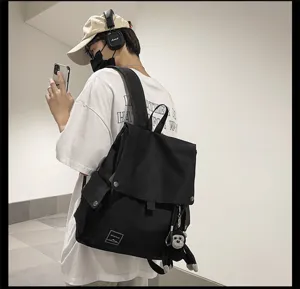 Casual canvas backpack for students, stylish flip cover minimalist daypack, black school bag.