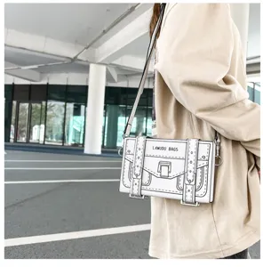 Detailed view of the creative 2D cartoon crossbody bag, showing unique sketch outline and straps.