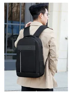 Close-up detail of a black business backpack with USB charging port and zipper pocket.