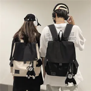 Casual campus backpack for men and women, stylish flap school bag with cute monkey pendant.