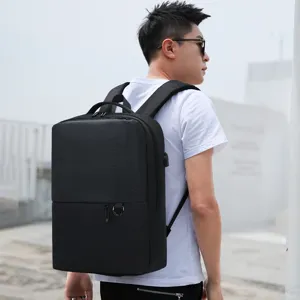 Stylish black business laptop backpack for men and women, urban casual travel daypack.