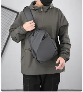 Detail view of the stylish black leather crossbody chest bag, perfect for urban street style.