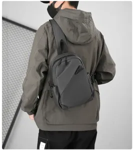 Detailed closeup view of urban black waterproof cross-body chest bag for men street style.