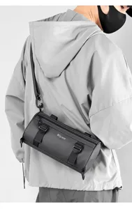 Detailed view of the trendy cylinder shoulder bag, featuring waterproof fabric and straps.