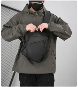 Close-up detail of the black street style sling chest bag featuring durable zippers and straps.