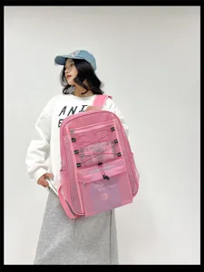 Zaino in rete rosa con grande capacità, design traspirante ideale per viaggi e spiaggia.