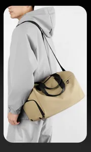 Waterproof duffel travel bag for gym and sports with wet dry separation and shoulder strap.
