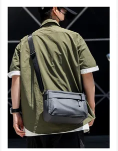 Men's grey waterproof crossbody messenger bag detail view for casual commute style