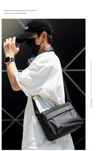 Mens black waterproof messenger bag with dual zippers, large capacity shoulder crossbody bag.