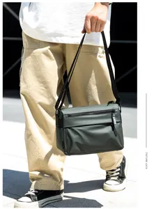 Men's waterproof messenger bag, large capacity shoulder crossbody bag for commute and cycling.
