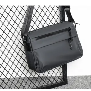 Men's dark grey waterproof crossbody shoulder bag with dual zippers and durable adjustable strap.