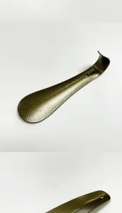 Stainless steel metal shoehorn detail view, durable portable thickened design with hanging hole.