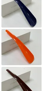 Plastic shoe horn detail view, portable long handle shoe helper in multiple colors for easy daily use.
