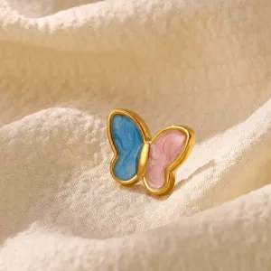 Close-up detail of the elegant colorful butterfly brooch with gold plating and enamel finish.