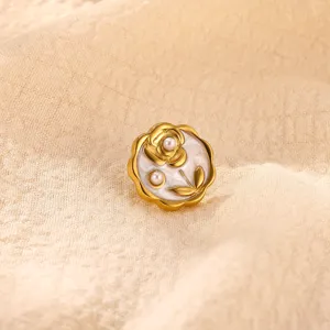 Exquisite stainless steel flower brooch detail, 18k gold plated with pearl inlay design.