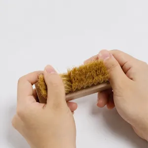 Portable square beech wood shoe cleaning brush with soft bristles for delicate leather care.