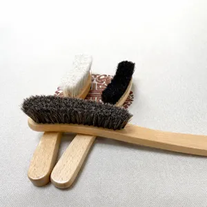 Wooden handle horsehair shoe brush for leather cleaning, polishing, and dust removal care.