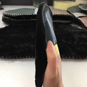 Faux wool shoe polishing glove with elastic band, soft leather back for daily footwear care.