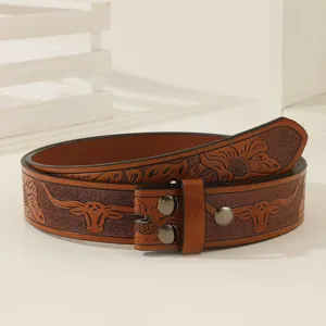 Detailed view of the brown embossed leather belt featuring western bull head and floral patterns.