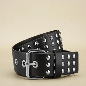 Black punk studded leather belt with silver metal buckle and rivets for versatile styling.