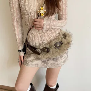 Y2K retro wasteland style faux fur studded belt and vintage cross necklace fashion outfit set.