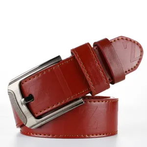 Red leather belt detail featuring a classic metal pin buckle and stylish embossed letter design.