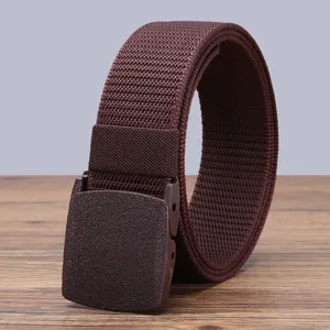 Detail shot of a brown tactical nylon belt with durable plastic buckle for outdoor sports.