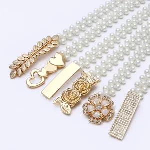 Pearl rhinestone waist chain detail shot showcasing diverse stylish metal buckles for dresses.