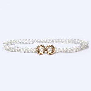 Elegant double-strand faux pearl waist belt featuring a chic gold interlocking buckle detail.
