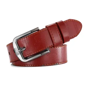 Men's vintage burgundy leather belt with metal pin buckle and stylish embossed skull pattern.