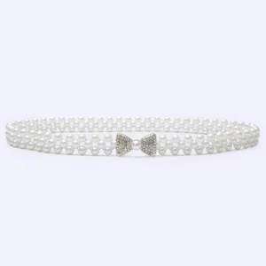 Exquisite pearl waist belt detail featuring a sparkling rhinestone bow and elastic double-row design.
